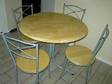 TABLE AND chairs. Round beech effect table and 4....